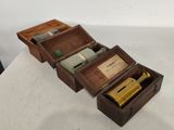 a wooden box with a bottle inside of it on a table