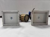 two white and blue vases sitting next to each other