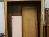 a large wooden cabinet with a radiator in it