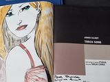 a drawing of a woman in a red dress in a book
