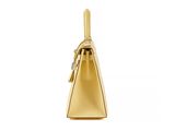 a gold purse on a white background