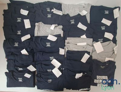 a lot of men ' s t - shirts that are on display