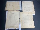 several old papers are sitting on a table with a price tag