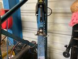 an image of a motorcycle being worked on in a garage