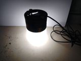 a light that is sitting on a table next to a lamp