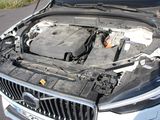 a car that has its hood open with the engine in it