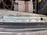 a close up of a car ' s front bumper with a number plate on it