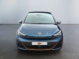 the front view of a blue car parked in a parking lot