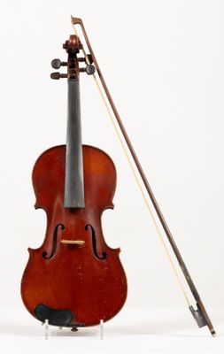 a violin that is sitting on a stand with a bow