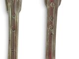 two spoons that are sitting next to each other