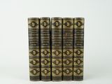 un lot de cinq livres anciens aux reliures dorées et noires