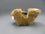 a teddy bear that has a tag on it ' s neck