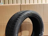 tire on the floor in a room with cardboard boxes and boxes