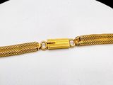a close up of a gold bracelet on a mannequin mannequin mannequin mannequin mannequin mannequin mannequin manne