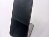 a cell phone that is sitting on top of a stand
