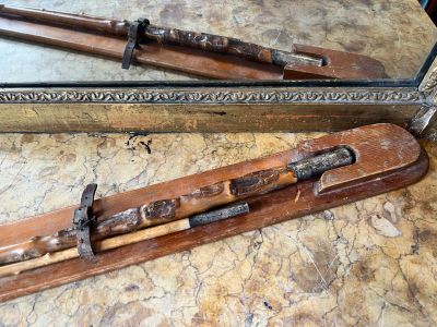 two old skis that are sitting on a table