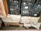 many crates of wood stacked on top of each other