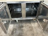 an oven with two doors open in a kitchen