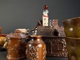 many different vases and jars on the table