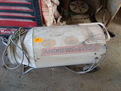 a machine that is sitting on the ground next to a pile of junk