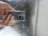 a person taking a picture of themselves in a mirror