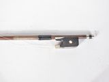 a violin bow with a string attached to it