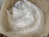 a plastic bag with a white object inside of it