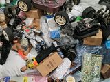 a cardboard box full of toys and other items
