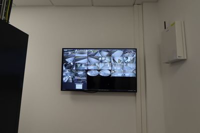 a flat screen tv mounted on the wall in a room