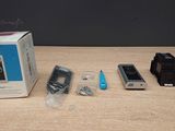 a box with a cell phone inside of it on a table