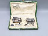 a green case with silverware in it on a table