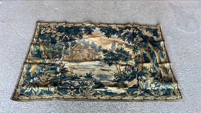 an image of a rug on the floor with a picture of a house in the background