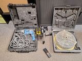a box with wires, a remote control, and a case with wires
