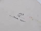 a close up of a white plate with writing on it