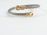 a pair of cable bracelets with gold clasps on a white background