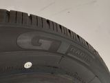 a close up of a tire on a white surface with a white background