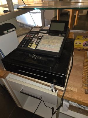 an image of a cash register on a counter in a store