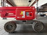 a red crane that is parked in a building