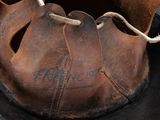 a baseball glove that has been left on the ground