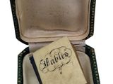 a small box with a book inside of it