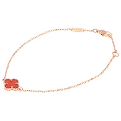 a bracelet with a red flower on a gold chain