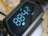 a digital clock on the handlebar of a bike