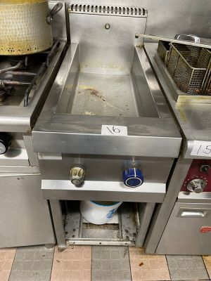 a picture of a commercial kitchen with stainless steel appliances