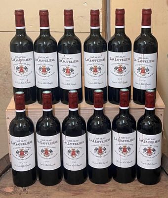 many bottles of wine sitting on a wooden crate