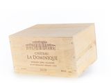 a wooden box with a bottle of wine inside of it