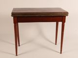 an old wooden table with a brown top and legs