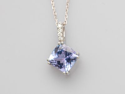 a tanzanite and diamond pendant on a chain