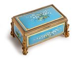 a blue and gold box with flowers on it