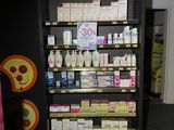 a display of cosmetics products on the shelves in a store