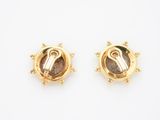 a pair of 18k yellow gold earrings with roman numerals and roman numerals